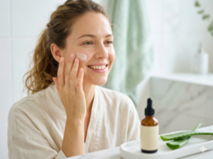 Person with glowing skin applying natural cream, using homeopathy medicine online for eczema.